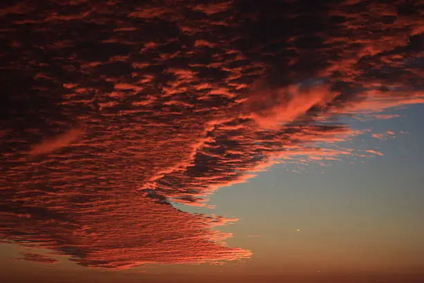 Rare landscape of the central part of Russia . Red clouds in the sky at sunset . Summer sunset .