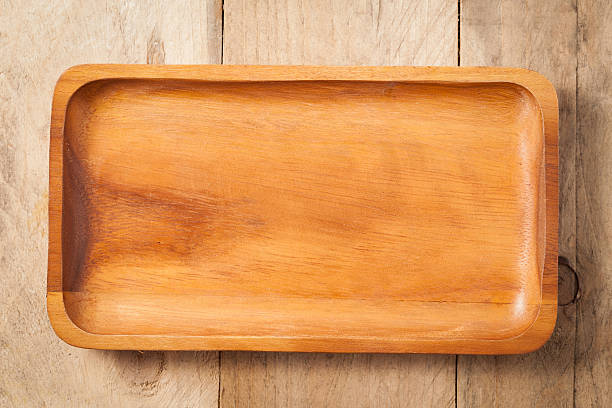 istock The brown wooden plate on a table. 495041500