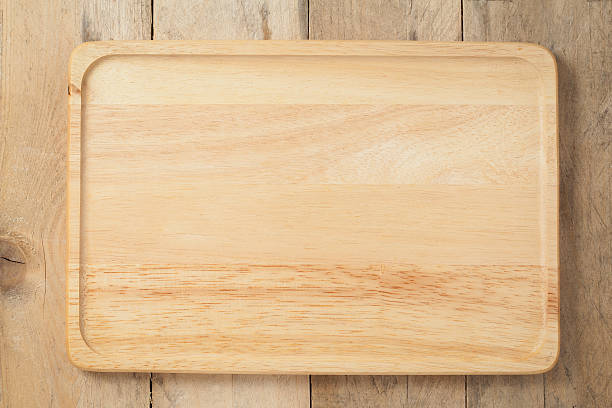 istock The brown wooden plate on a table. 495041698