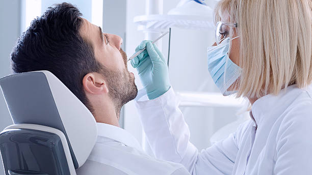 istock Young man at the dentist 495049706