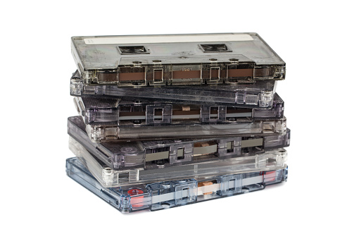 Stack of audio cassettes isolated on white background