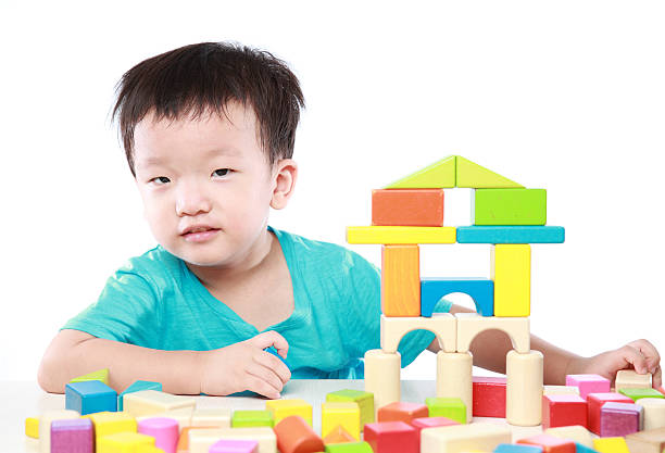 A closeup of blue children's blocks stacked in the shape of a car