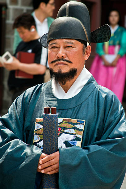 Seoul, Korea - September 14, 2012: Tourists visit Gyeongbokgung Palace, Ancient Korean palace.This is Gyeongbokgung Palace Ancient guard changing Traditional Ceremony performance. Performance of ancient Korean Emperor Period palace ceremony. In order to better promote the traditional Korean culture.