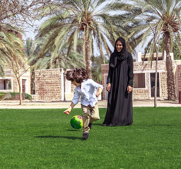 istock Traditional Young Arabic family having fun outdoors at sunny day 495051484