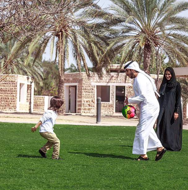 istock Traditional Young Arabic family having fun outdoors at sunny day 495051606