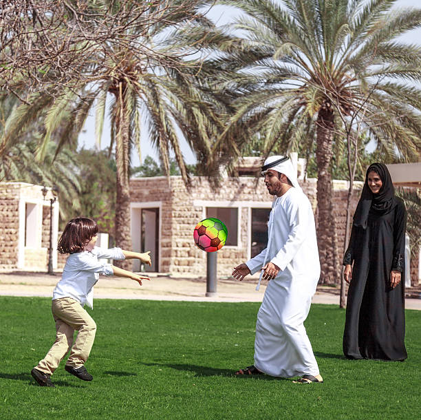 istock Traditional Young Arabic family having fun outdoors at sunny day 495051684