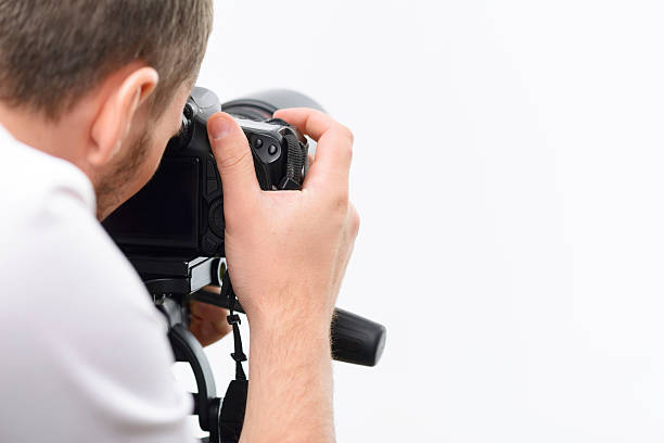 istock Handsome photographer working with professional camera 495054016