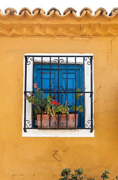 Andalusia window Old window with flower pots in old town of Marbella, Malaga, Andalusia, Spain spanish flower pots stock pictures, royalty-free photos & images