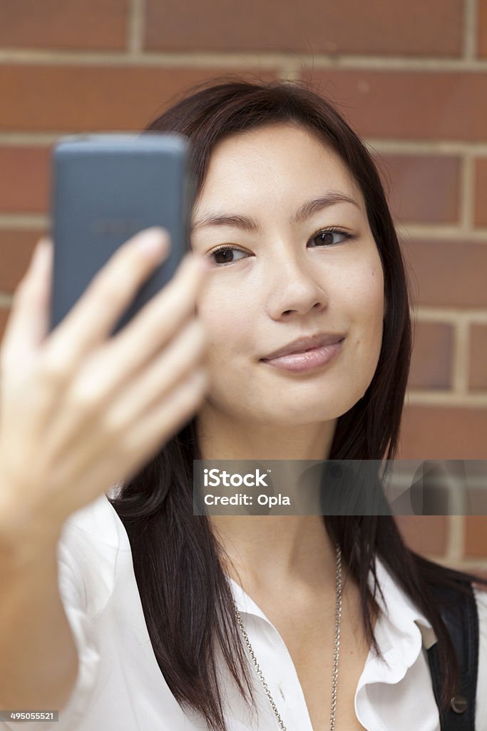 Asian woman photographing herself 20-24 Years Stock Photo