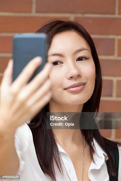 Asian Woman Photographing Herself Stock Photo - Download Image Now - 20-24 Years, 20-29 Years, Adult