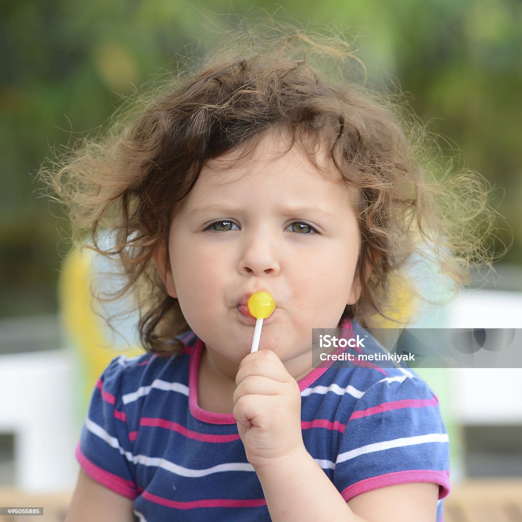 portrait little boy licking lilipop Boy 2 3 licking lollipop Stock Photo Dissolve