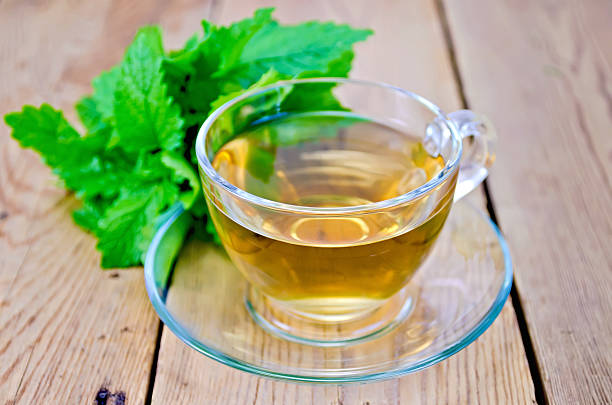 istock Herbal tea with melissa on a wooden board 495056435