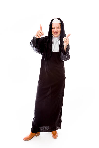 istock Young nun showing thumbs up sign from both hands 495057825