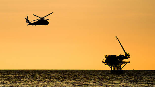 istock oil platform silhouette on the sea 495059801