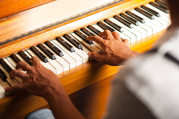 istock Man playing piano, closeup shot 495060095
