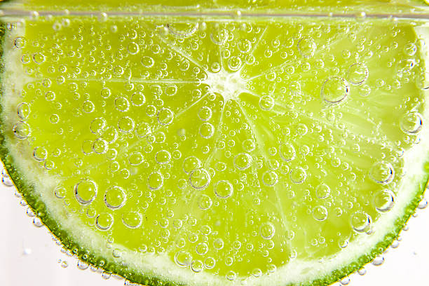 istock slice of lime  in the water with bubbles 495060891