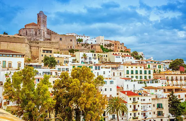 The historic town center (Dalt Vila) and cathedral of Ibiza town under dramatic sky