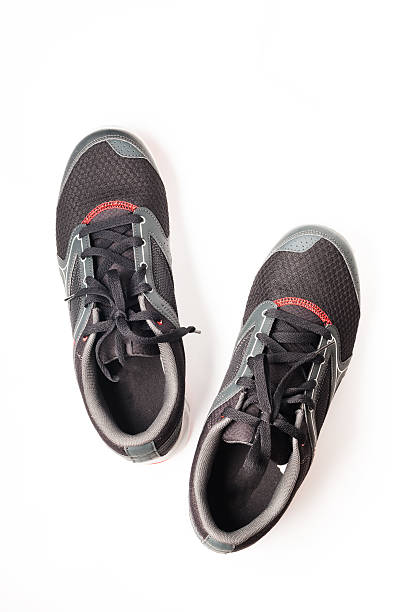 istock New unbranded running shoe color black, sneaker or trainer isolated 495063694