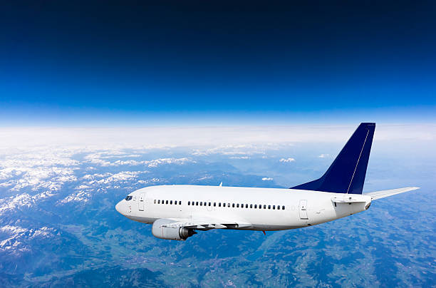 istock aeroplane.  Airplane over the mountains 495063898