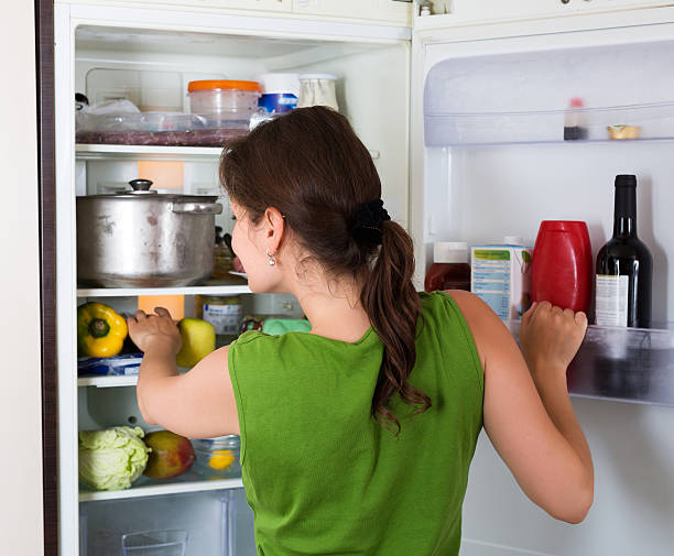 istock Woman looking in fridge 495067650