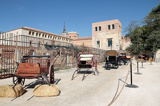 horse carriages outdoor exposition of antique horse carriages on a medieval market at Alcala de Henares, Spain alcala de henares stock pictures, royalty-free photos & images