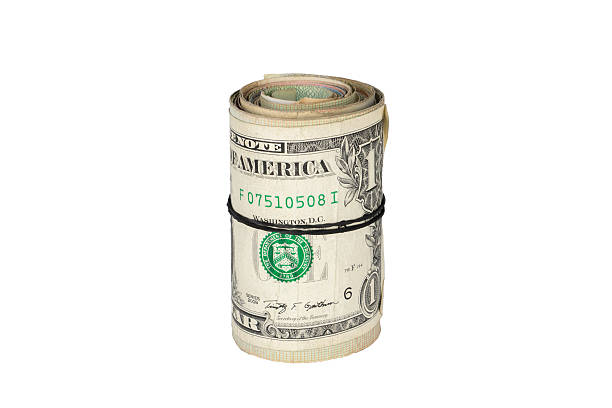 istock Twisted roll of dollars in the hand 495068842