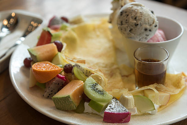 istock Crepes, cakes, ice cream and fruit. 495077442