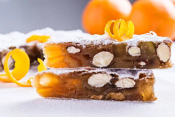 Panforte traditional italian christmas cake, fruitcake or peppered bread typical of Siena.