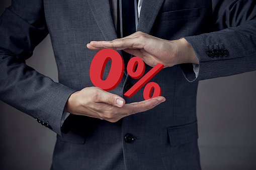 Business man Presenting Zero Percent, indicating zero interest and other financial percentage