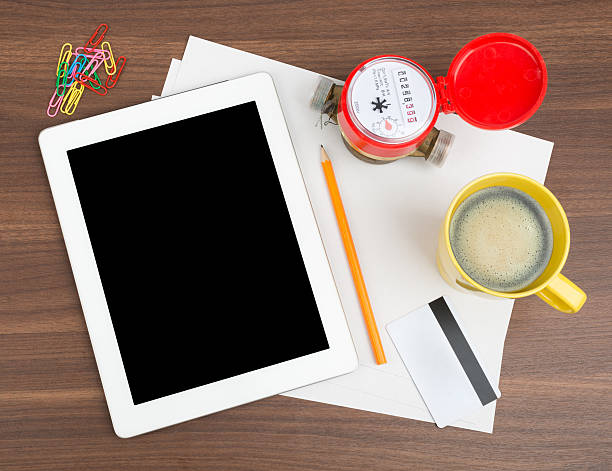 istock Tablet with blank paper and water meter 495080504