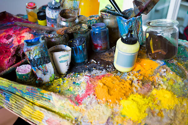 istock colorful artist's workspace with paints and brushes 495080520