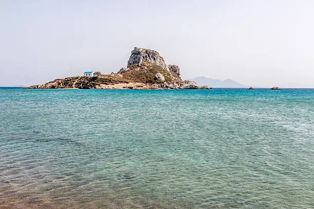 The old chapel of Agios Stefanos sits on a deserted small island swimming distance from the Kefalos beach.