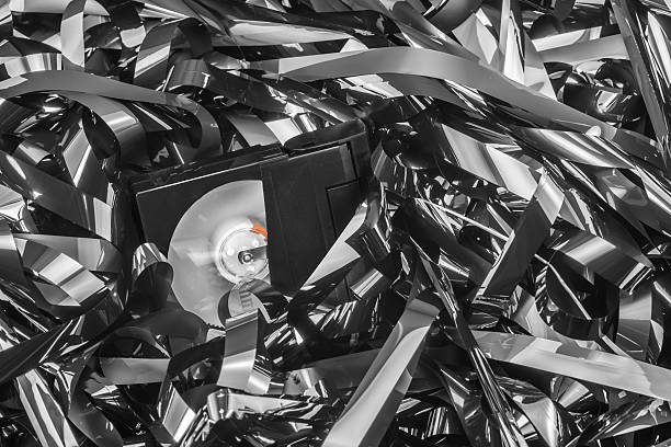 istock Messy reel-to-reel tape with video cassette 495081458