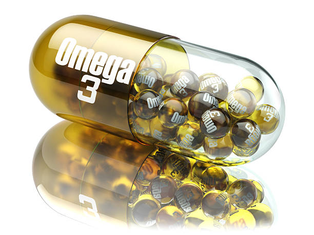 pillola con elemento di omega 3. integratori alimentari. capsula di vitamina - cod liver oil fish oil capsule yellow foto e immagini stock