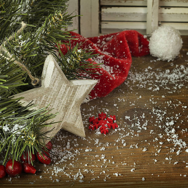 istock Christmas fir tree with  red hat and snow 495083606