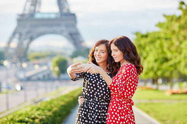 istock Beautiful twin sisters taking selfie in front of Eiffel Tower 495083754