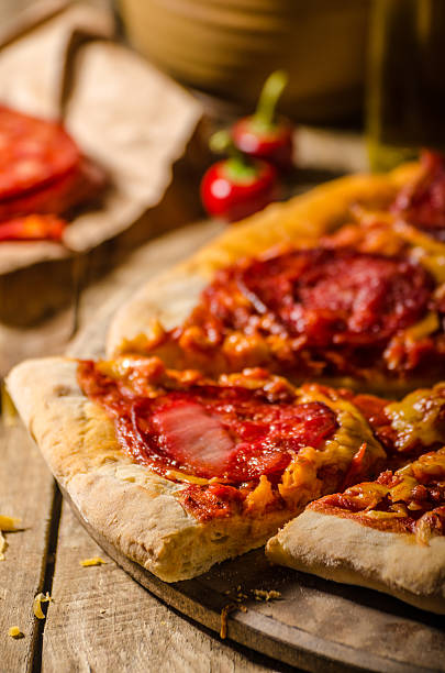 istock Rustic salami pizza with cheddar cheese and chorizo 495084864