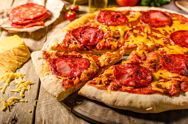 istock Rustic salami pizza with cheddar cheese and chorizo 495092104