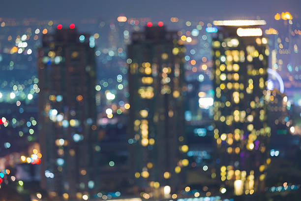 istock Blurred bokeh city lights city building at night 495093728