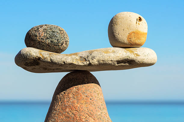 istock Balance of black and white pebbles 495094352