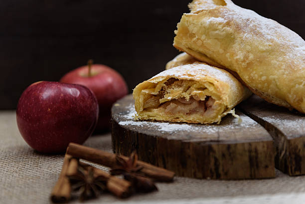 istock Apple strudel on wooden end of a tree with apples 495094622
