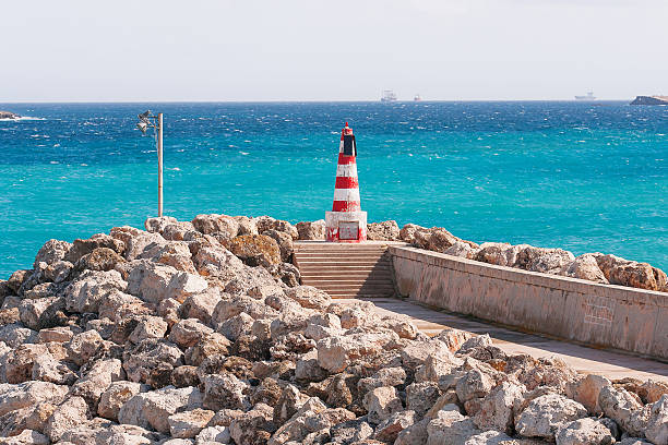 istock Entrance in bay, seafront with lighthouse on seafront. Gozo, Malta. 495095312