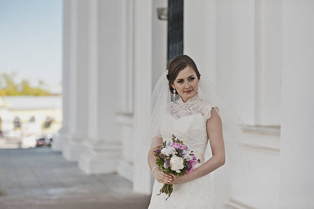 istock Portrait of a young bride about the white columns 495099082