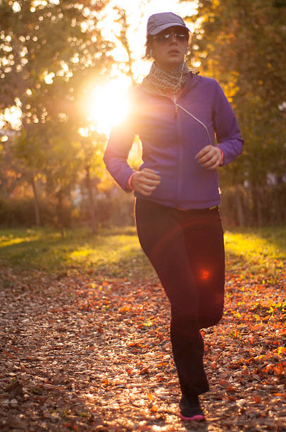 istock Young women running in park in autumn before sunset 495099236