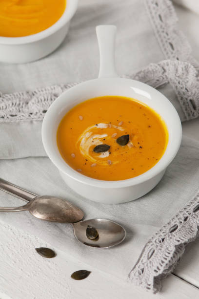 istock Pumpkin soup in white china bowl. Vegetable soup. 495099814