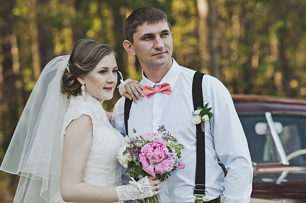 istock Young family around rare car 495108598