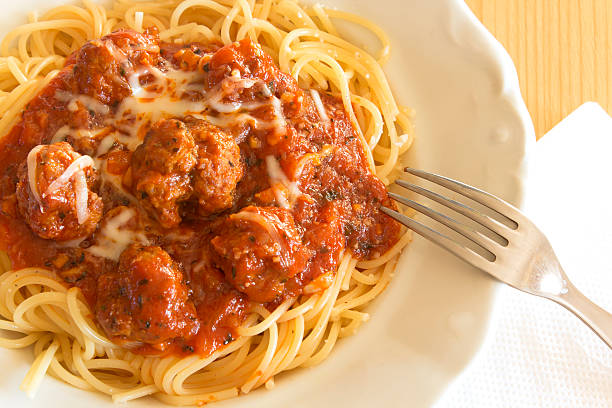 Spaghetti with meatballs in tomato sauce.