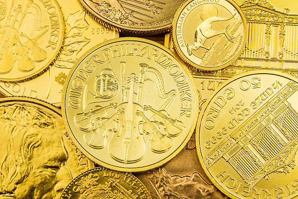 stack of golden coins stack of various golden coins ounce stock pictures, royalty-free photos & images
