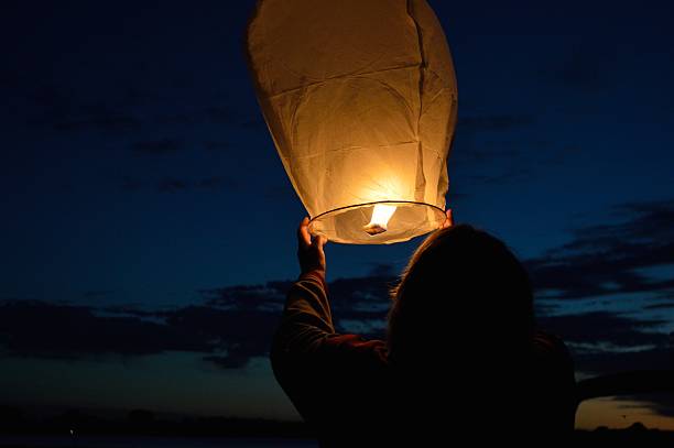 Lady Releasing a Lantern at Dusk