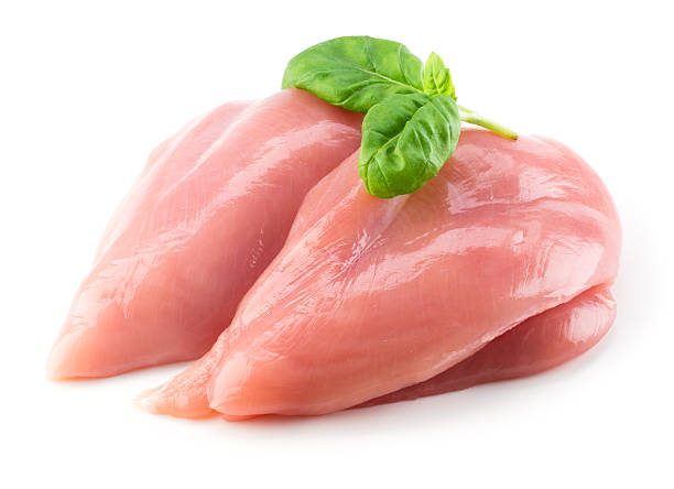 istock Raw chicken fillet with basil isolated on white 495113190